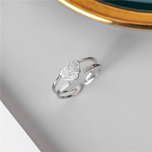 An elegant heart Adjustable 925 Sterling Silver Ring with Cubic Zirconia crystals.