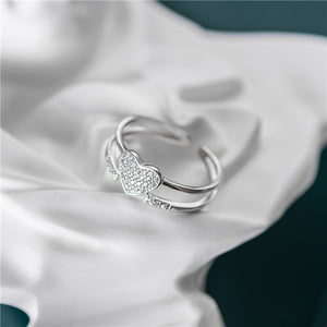 An elegant heart Adjustable 925 Sterling Silver Ring with Cubic Zirconia crystals.